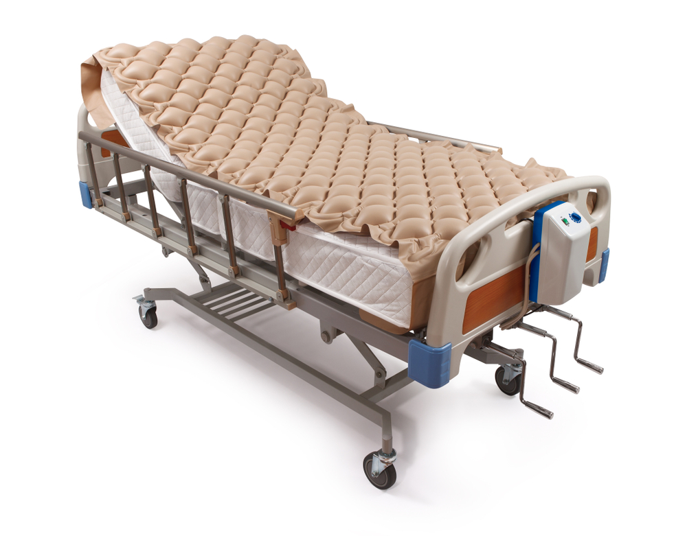 putting a regular mattress in a hospital bed